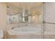 Bathroom featuring a corner jetted tub with tile surround, providing a luxurious spa-like experience at 2777 Paradise Rd # 607, Las Vegas, NV 89109