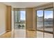 Bright living room with hardwood floors, expansive windows, and views at 2777 Paradise Rd # 607, Las Vegas, NV 89109