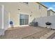 Private backyard features a stone patio, white fence, and barbecue, perfect for relaxation and outdoor entertainment at 2949 White Selzter Ct, Las Vegas, NV 89122