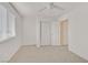 Bright bedroom featuring natural light through a window, ample closet space, and neutral-toned carpet, promoting comfort and serenity at 2949 White Selzter Ct, Las Vegas, NV 89122
