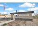 Independence Planned Community entrance featuring stone accents, modern architecture and lush landscaping at 2949 White Selzter Ct, Las Vegas, NV 89122