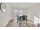 Bright dining area with table, modern lighting, and sliding glass doors at 2949 White Selzter Ct, Las Vegas, NV 89122