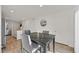 Modern dining area adjacent to kitchen, featuring hardwood floors and contemporary decor at 2949 White Selzter Ct, Las Vegas, NV 89122
