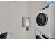 Well-equipped laundry room with a modern washer and dryer set, plus an Enphase electric panel, ensuring efficient laundry care at 2949 White Selzter Ct, Las Vegas, NV 89122