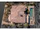 Unique aerial view of the property layout, showcasing the pool, putting green, and outdoor kitchen at 30 Meadowhawk Ln, Las Vegas, NV 89135