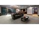 Finished basement features bar, lounge, and sliding glass doors to patio at 30 Meadowhawk Ln, Las Vegas, NV 89135