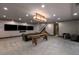 Finished basement features a lounge area, entertainment area, and modern recessed lighting at 30 Meadowhawk Ln, Las Vegas, NV 89135