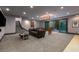 Finished basement has carpeted floors, recessed lighting, and access to a private patio at 30 Meadowhawk Ln, Las Vegas, NV 89135