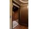 Elevator with wood paneled interior and exterior door with fluted design at 30 Meadowhawk Ln, Las Vegas, NV 89135