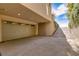 Exterior of a home featuring a private two-car garage and a concrete driveway leading to a street at 30 Meadowhawk Ln, Las Vegas, NV 89135