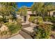 Inviting front entrance featuring stone steps and beautiful landscaping at 30 Meadowhawk Ln, Las Vegas, NV 89135