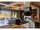 Modern living area with stone accent wall, fireplace, and open floor plan at 30 Meadowhawk Ln, Las Vegas, NV 89135