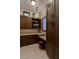 Office features include ample cabinet space, granite countertops, work area, and elegant lighting at 30 Meadowhawk Ln, Las Vegas, NV 89135