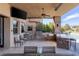 Well-equipped outdoor kitchen featuring a grill, bar, and dining area at 30 Meadowhawk Ln, Las Vegas, NV 89135