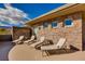 Relaxing rooftop patio featuring multiple lounge chairs with beautiful masonry and mountain views at 30 Meadowhawk Ln, Las Vegas, NV 89135