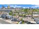 A residential neighborhood features a two-story home needing repair with palm trees and desert landscaping in the background at 3009 Merritt Ave, Las Vegas, NV 89102