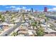 A cityscape view overlooks a neighborhood with diverse rooftops and tree-lined streets under a clear blue sky at 3009 Merritt Ave, Las Vegas, NV 89102