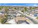 Neighborhood aerial view showcasing nearby mountains and residential homes with an empty pool on the property at 3009 Merritt Ave, Las Vegas, NV 89102