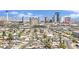 Cityscape aerial view showing an empty pool in the foreground and the Las Vegas strip towering in the distance at 3009 Merritt Ave, Las Vegas, NV 89102