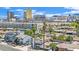 Aerial neighborhood view featuring the Las Vegas skyline and nearby homes with an empty swimming pool at 3009 Merritt Ave, Las Vegas, NV 89102