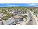 Aerial shot of a neighborhood showcasing an empty pool on a property with views of the mountains in the distance at 3009 Merritt Ave, Las Vegas, NV 89102