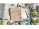 A neighborhood shows a house with a pool, a damaged roof, and overgrown landscaping at 3009 Merritt Ave, Las Vegas, NV 89102