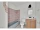 Modest bathroom featuring a vanity, toilet, and a bathtub with a shower at 3009 Merritt Ave, Las Vegas, NV 89102
