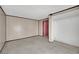 Bedroom with wood paneled walls and pink door at 3009 Merritt Ave, Las Vegas, NV 89102