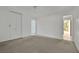 A bright bedroom with large closet and a view into an adjacent space at 3009 Merritt Ave, Las Vegas, NV 89102