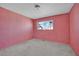 Inviting pink bedroom with a window allowing ample natural light at 3009 Merritt Ave, Las Vegas, NV 89102