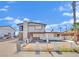 Two-story home with mixed brick and siding exterior and front yard needing revitalization at 3009 Merritt Ave, Las Vegas, NV 89102