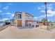 Two-story home with mixed brick and siding exterior and front yard needing revitalization at 3009 Merritt Ave, Las Vegas, NV 89102