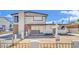 Two-story home with mixed brick and siding exterior and front yard needing revitalization at 3009 Merritt Ave, Las Vegas, NV 89102