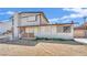 Two-story home with mixed brick and siding exterior and front yard needing revitalization at 3009 Merritt Ave, Las Vegas, NV 89102