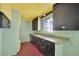 Retro kitchen features a double sink and contrasting cabinets at 3009 Merritt Ave, Las Vegas, NV 89102