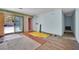 Spacious living room needing renovations, with a sliding door to the pool at 3009 Merritt Ave, Las Vegas, NV 89102