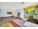 Open living room and kitchen area with hardwood floors and space for renovation at 3009 Merritt Ave, Las Vegas, NV 89102