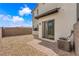 This backyard features a brick patio and desert landscaping at 3192 Timorasso Ave, Henderson, NV 89044