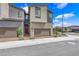 Two-story townhome with modern architectural details and a two-car garage at 3192 Timorasso Ave, Henderson, NV 89044
