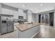 Modern kitchen with stainless steel appliances, granite countertops, and a central island at 3192 Timorasso Ave, Henderson, NV 89044