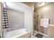 Bright bathroom featuring a shower with glass door and a separate tub at 361 Tobler Dr, Las Vegas, NV 89145