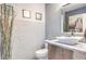 Modern bathroom with decorative wall, unique countertop sink, and stylish fixtures at 361 Tobler Dr, Las Vegas, NV 89145