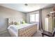 Comfortable bedroom featuring a large, upholstered bed with modern decor and bright natural light at 361 Tobler Dr, Las Vegas, NV 89145