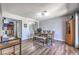 Casual dining room with laminate flooring, a modern table set, and a view into the laundry area at 361 Tobler Dr, Las Vegas, NV 89145