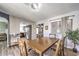 Inviting dining room with wood table, chairs, and window views providing natural light and neutral paint at 361 Tobler Dr, Las Vegas, NV 89145