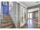 Inviting entryway features staircase, wood-look floors and double glass doors offering plenty of natural light at 361 Tobler Dr, Las Vegas, NV 89145