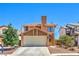 Charming two-story home with a well-maintained front yard and attached two-car garage in a friendly neighborhood at 361 Tobler Dr, Las Vegas, NV 89145