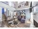 Stylish living room with comfortable seating, a chic rug, and a view of the upper level at 361 Tobler Dr, Las Vegas, NV 89145