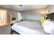 Comfortable primary bedroom features a large bed, neutral walls, and ensuite bath at 361 Tobler Dr, Las Vegas, NV 89145