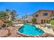 Backyard pool and patio offering a refreshing escape with ample space for lounging at 361 Tobler Dr, Las Vegas, NV 89145